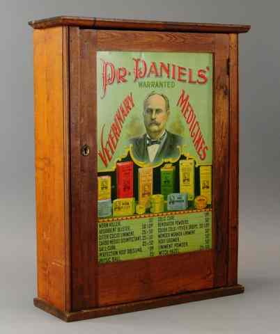 Appraisal: 'DR DANIEL'S VETERINARY MEDICINES'' CABINET Embossed tin door panel depicts