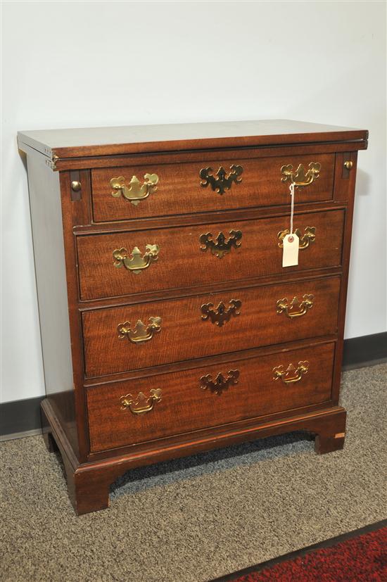 Appraisal: SMALL BAKER CHEST OF DRAWERS Mahogany chest having a flip