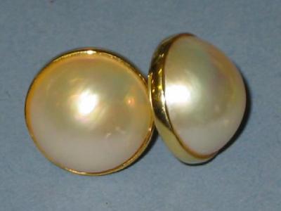 Appraisal: A PAIR OF MABE PEARL EAR STUDS the circular pearls