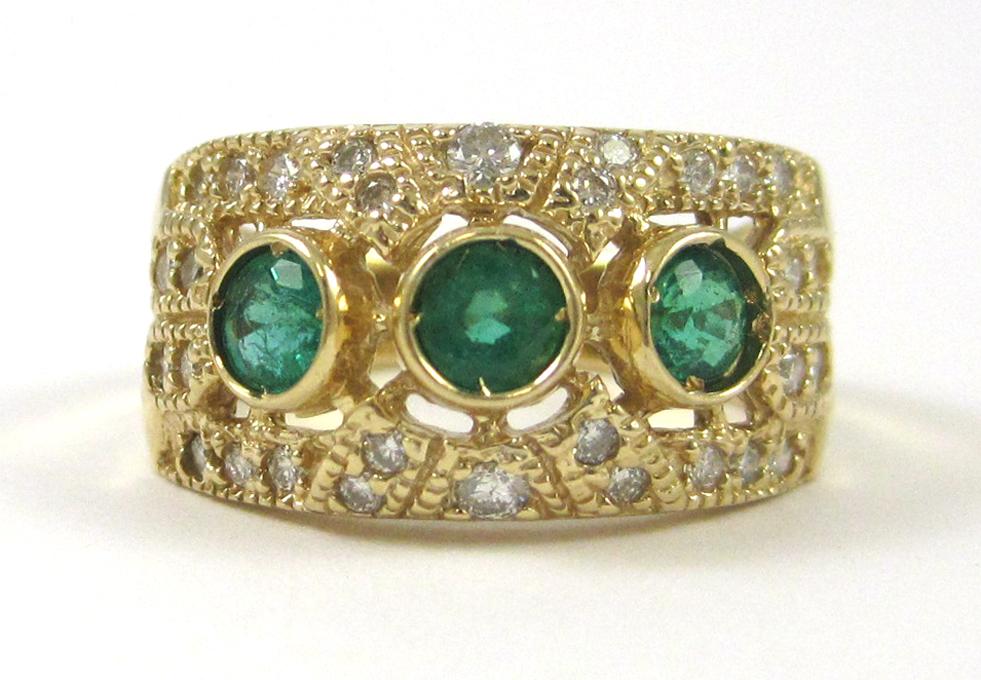 Appraisal: EMERALD DIAMOND AND FOURTEEN KARAT GOLD RING with round-cut diamonds