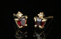 Appraisal: A Pair of Garnet Diamond Ear Studs A pair of