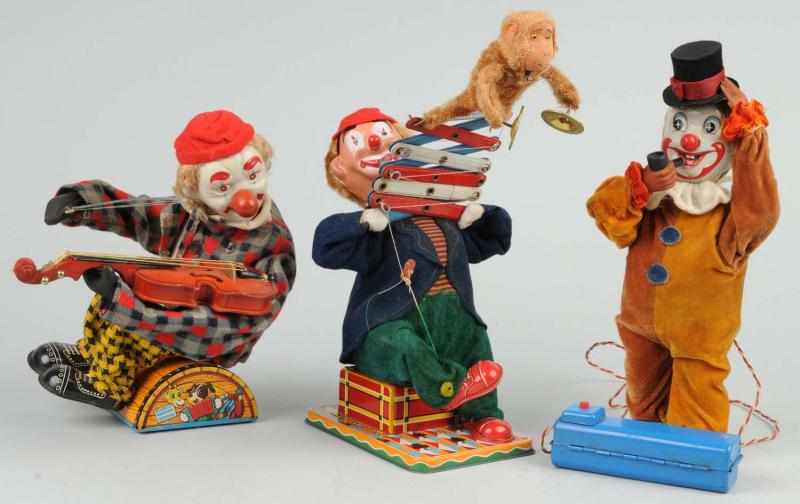 Appraisal: Lot of Battery-Operated Clown Toys Description Japanese Working Includes one