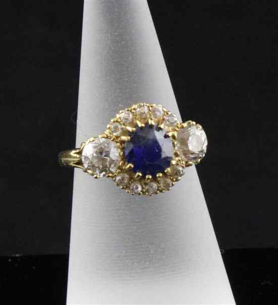 Appraisal: An ct gold sapphire and diamond cluster ring the central