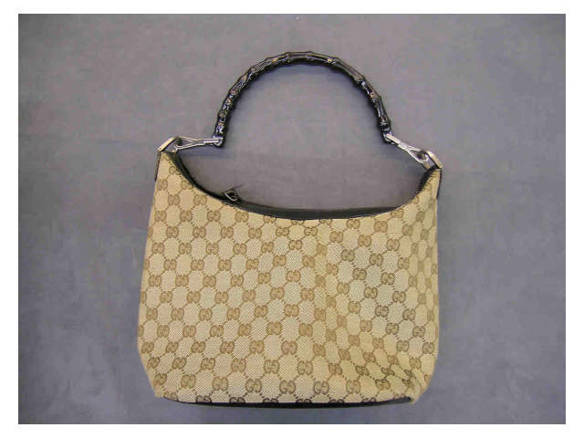 Appraisal: Gucci handbag brown logo fabric with black leather trim and