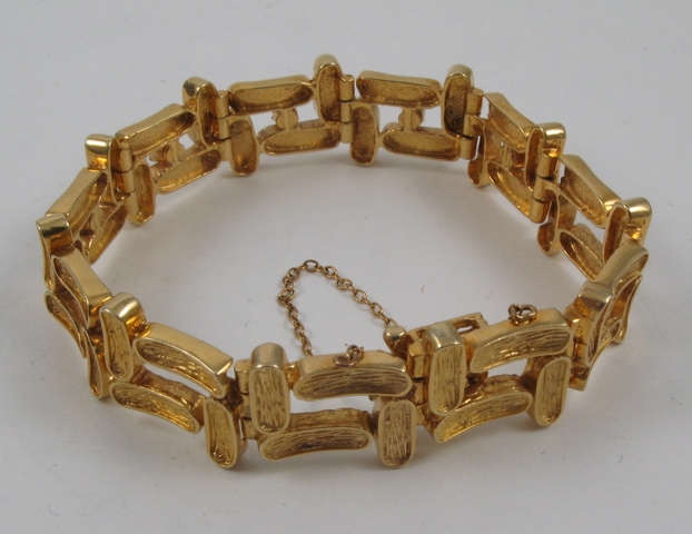 Appraisal: DIAMOND AND FOURTEEN KARAT GOLD BRACELET set with five round