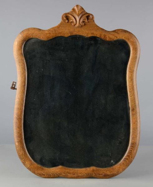 Appraisal: Shield Shaped Mirror This beveled shield shaped mirror has an