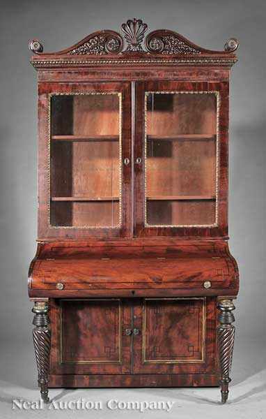 Appraisal: An American Classical Carved and Inlaid Mahogany Desk and Bookcase