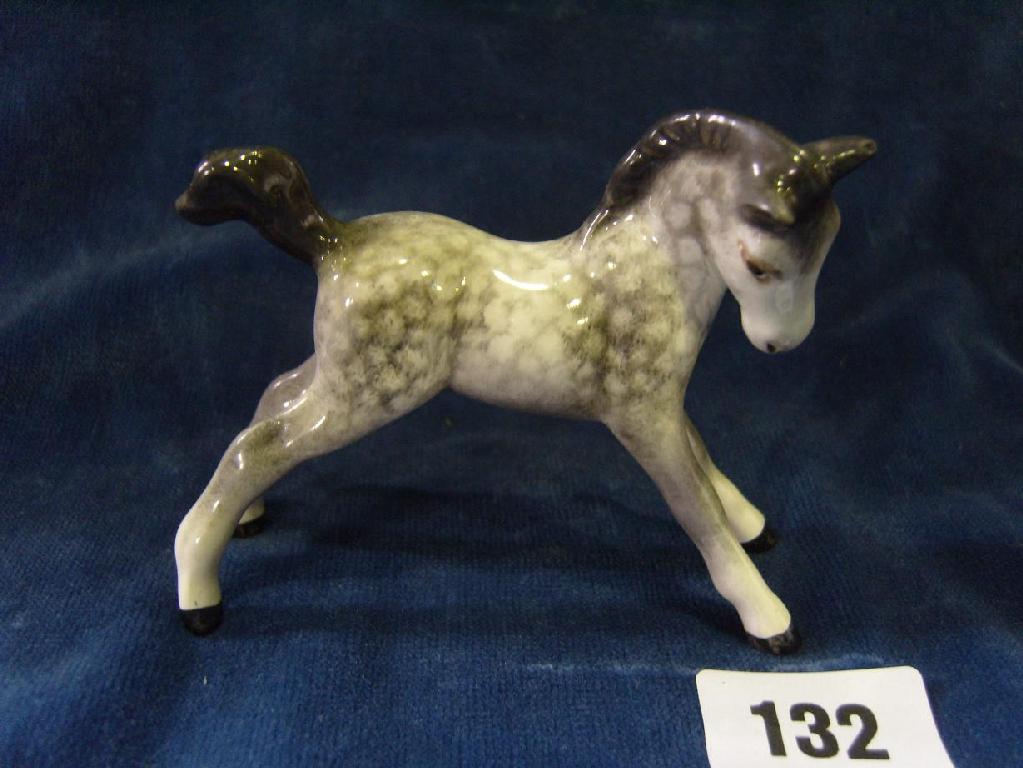 Appraisal: A Beswick model of a prancing foal in the rocking