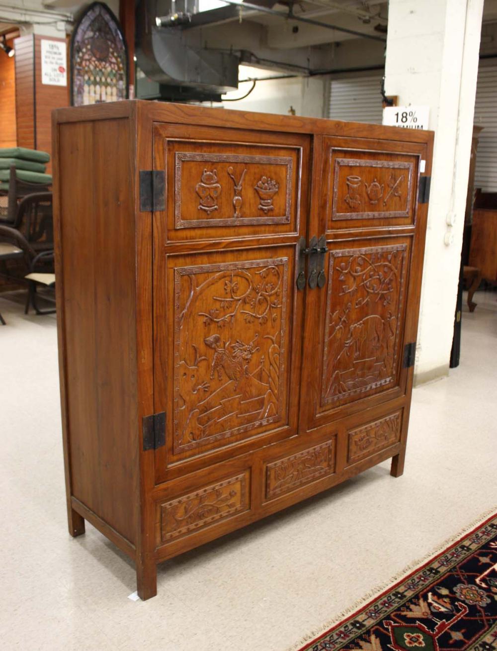 Appraisal: LARGE CARVED MING STYLE DOUBLE-DOOR CABINET Chinese th century the