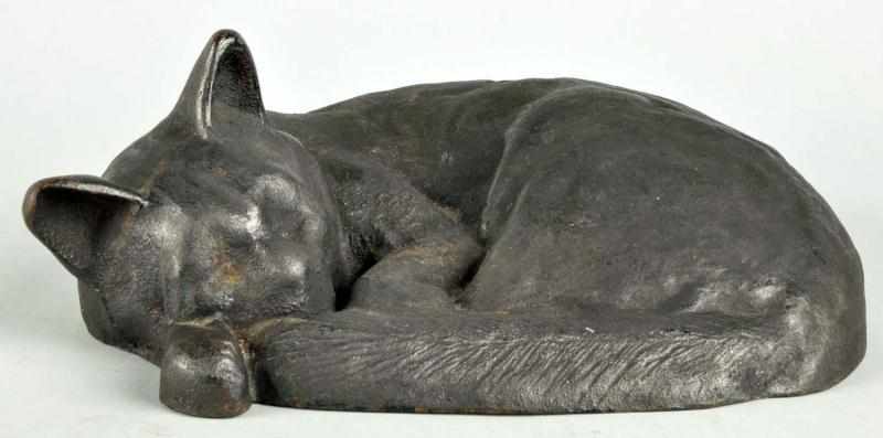 Appraisal: Cast Iron Sleeping Cat Doorstop Description Made by Albany or