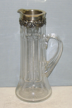 Appraisal: ANTIQUE AMERICAN CUT GLASS AND SILVER JUG The handled glass