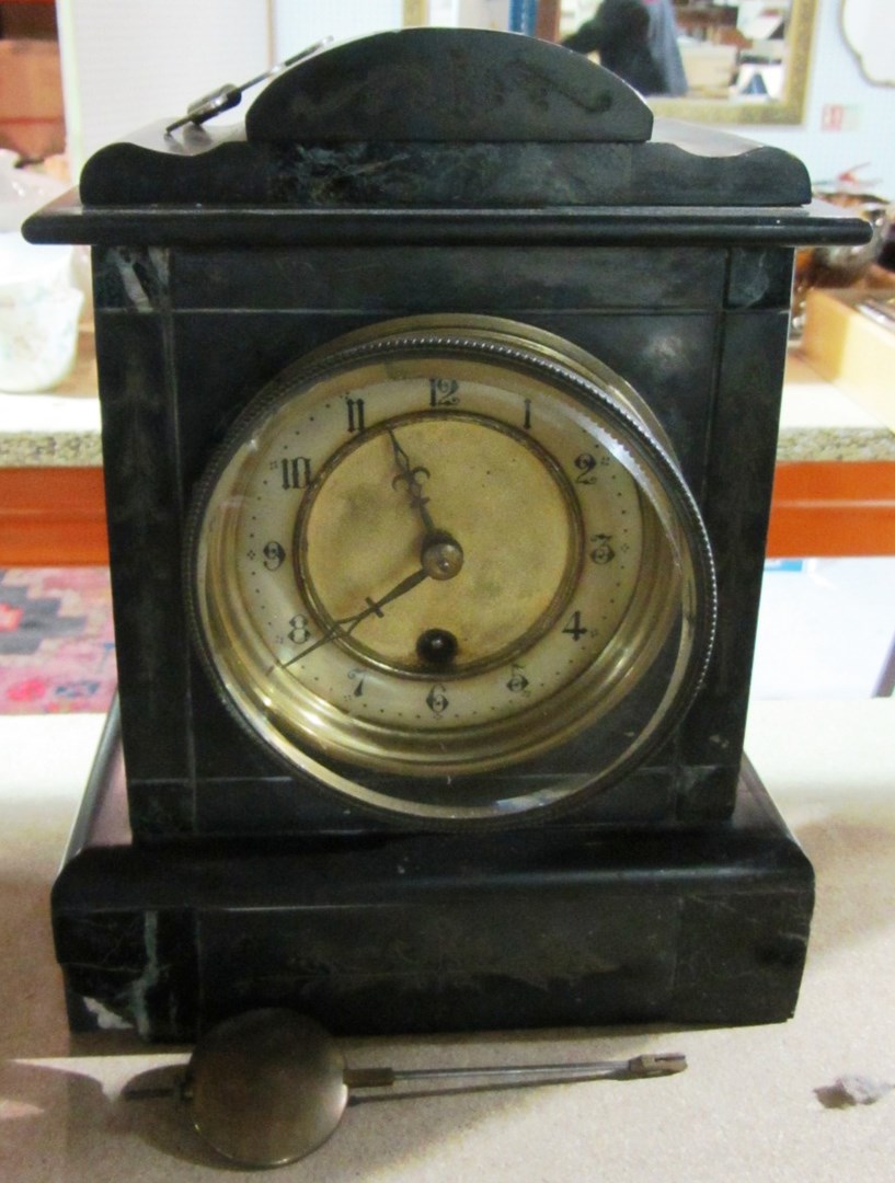 Appraisal: A th century black slate mantel clock