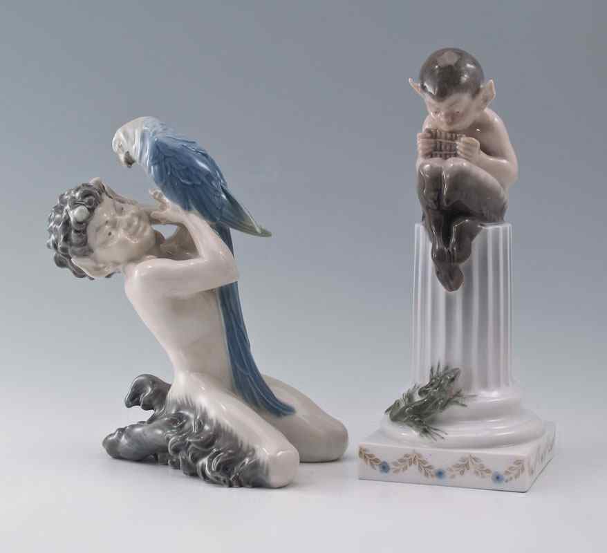 Appraisal: TWO ROYAL COPENHAGEN FAUN FIGURES Faun with Parrot '' tall