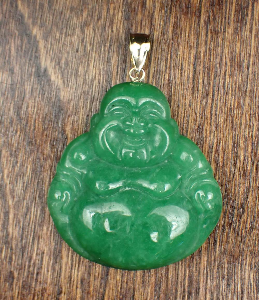 Appraisal: JADE AND FOURTEEN KARAT GOLD PENDANT with a k yellow