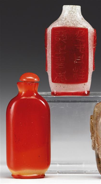 Appraisal: Chinese red glass overlay and a simulated hornbill glass snuff