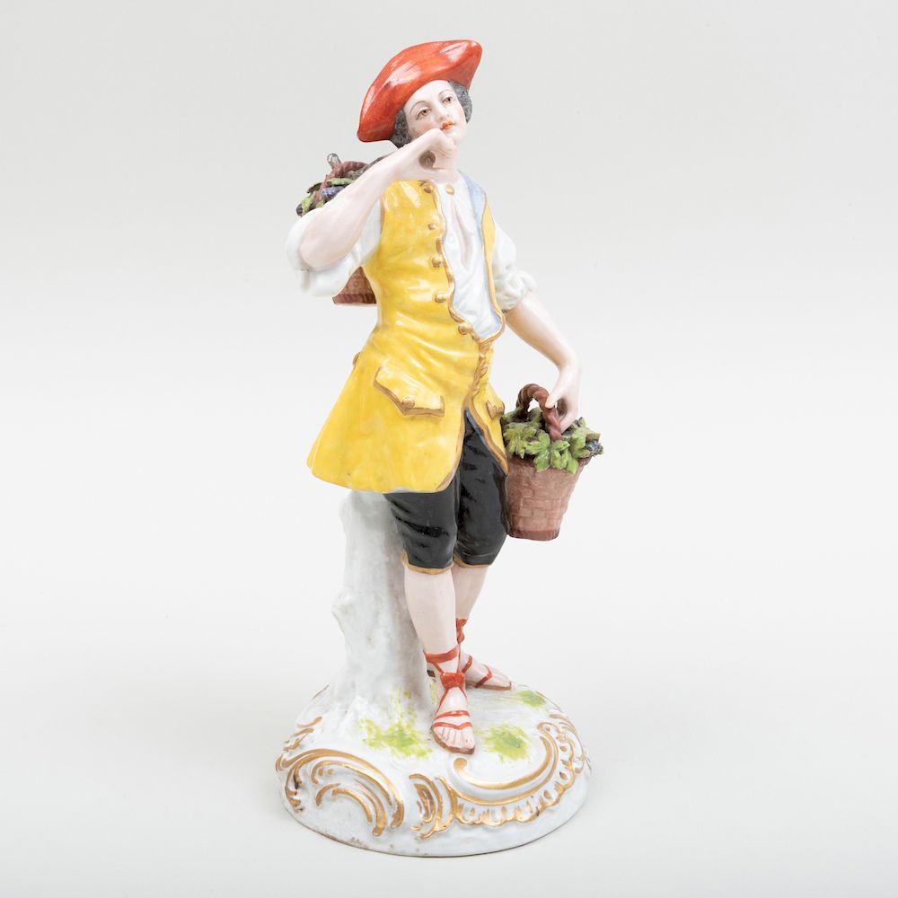 Appraisal: French Porcelain Figure in a Yellow Vest Emblematic of Fall