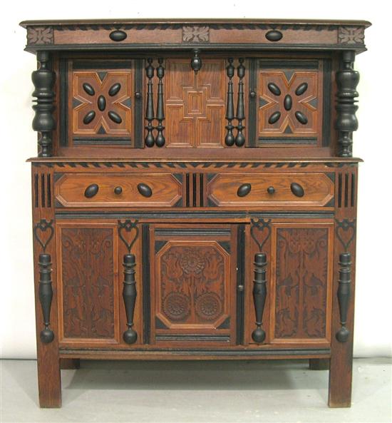 Appraisal: Wallace Nutting Sunflower court cupboard oak case with carving ebonized