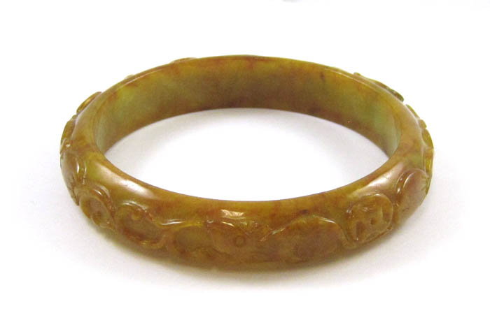 Appraisal: HEAVY RED AND GREEN CARVED JADE BANGLE weighing grams The