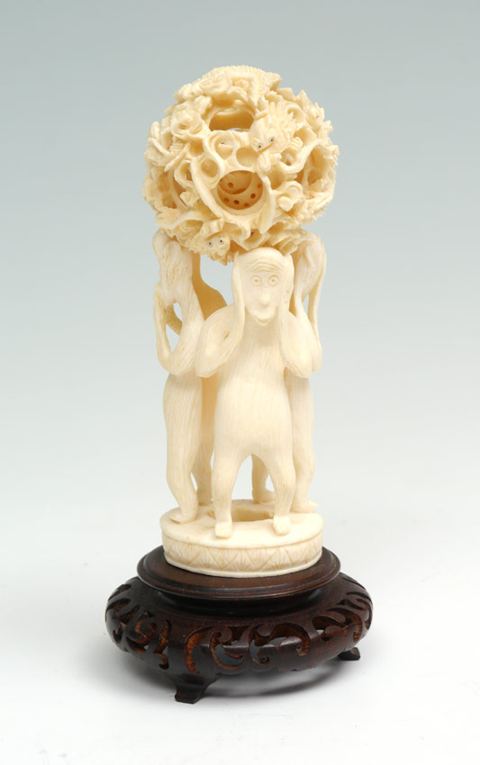 Appraisal: IVORY MYSTERY BALL ON FIGURAL STAND Ball with dragon motif