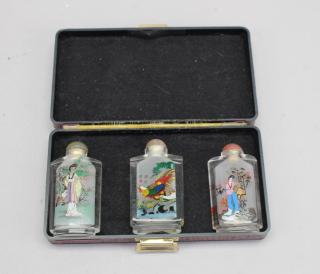 Appraisal: Reverse Painted Snuff Bottles w Case Reverse Painted Snuff Bottles