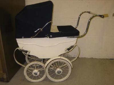 Appraisal: A mid th century dolls pram with white painted wood