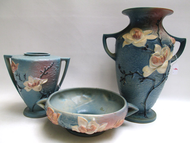 Appraisal: THREE ROSEVILLE ART POTTERY in the Magnolia pattern of blue