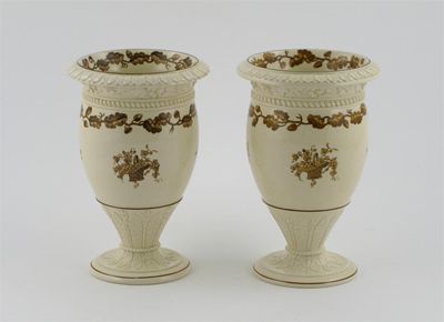 Appraisal: A pair of Wedgwood creamware vases painted in sepia tones