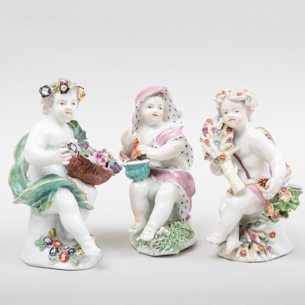 Appraisal: Group of Three English Porcelain Putti Allegorical of the Seasons