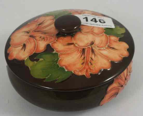 Appraisal: Moorcroft round box cover decorated in the Hibiscus Design on