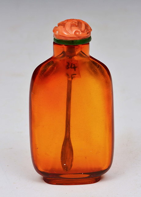 Appraisal: A CHINESE FLATTENED RECTANGULAR TRANSLUCENT ORANGE AND AMBER SNUFF BOTTLE