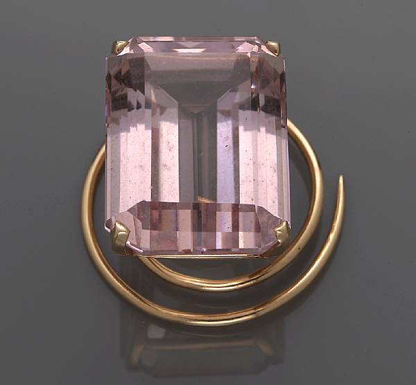 Appraisal: A morganite brooch centering a rectangular-shaped morganite measuring approximately x