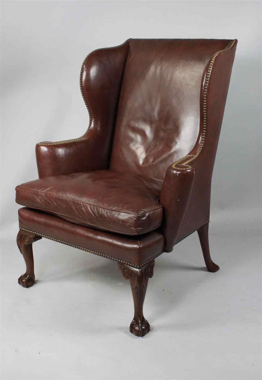 Appraisal: KITTINGER CHIPPENDALE STYLE MAHOGANY AND BROWN LEATHER WING CHAIR straight