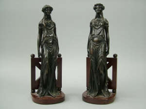 Appraisal: A pair of bronze and mahogany Continental style figural bookends