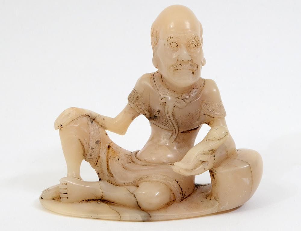 Appraisal: CHINESE CARVED SOAPSTONE SEATED LOHAN The figure clad in a