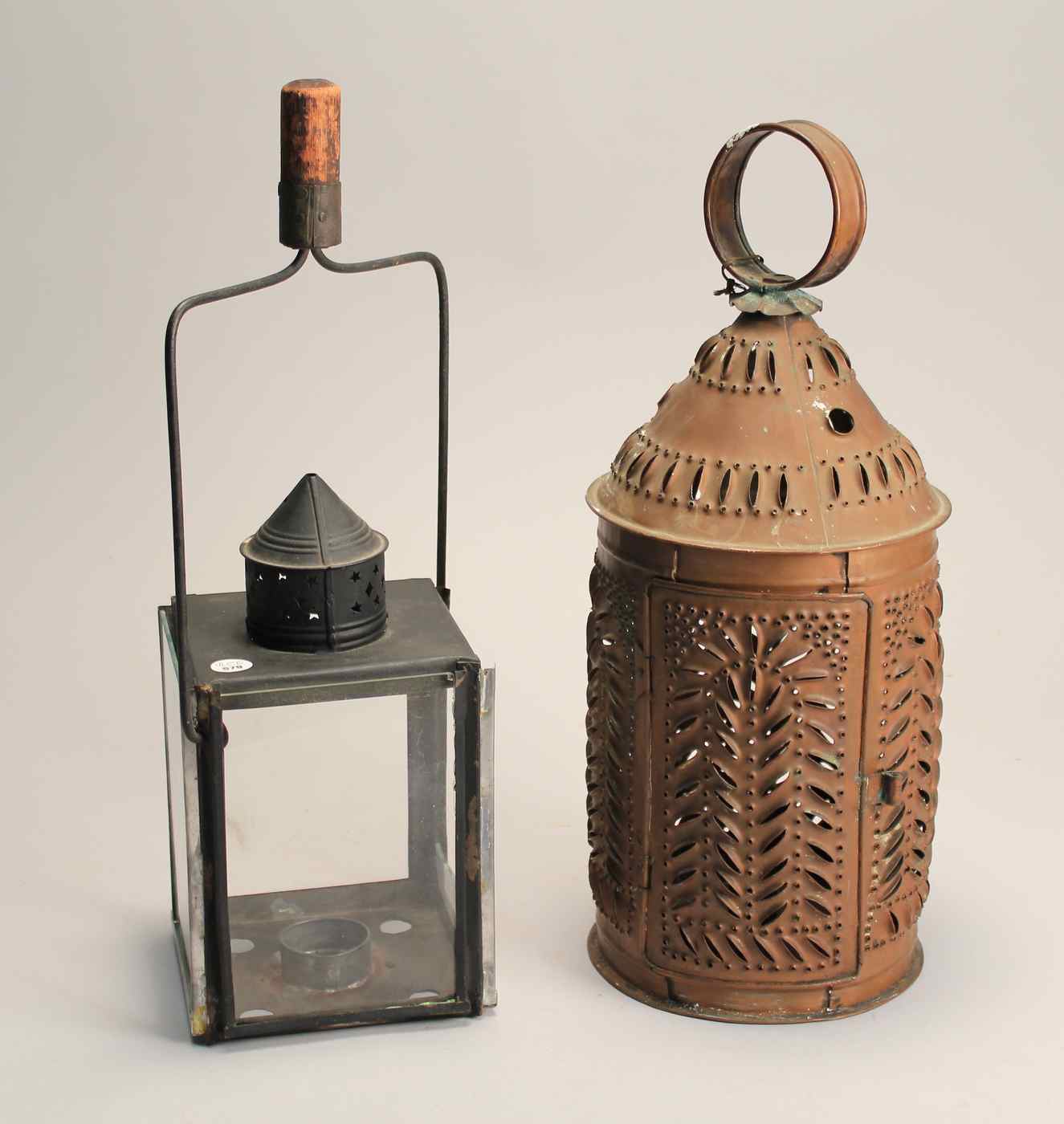 Appraisal: TWO LANTERNS th CenturyA pierced brass lantern height and a