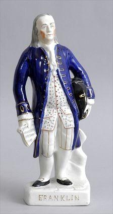 Appraisal: STAFFORDSHIRE-TYPE FIGURE OF BENJAMIN FRANKLIN Modeled standing in blue top