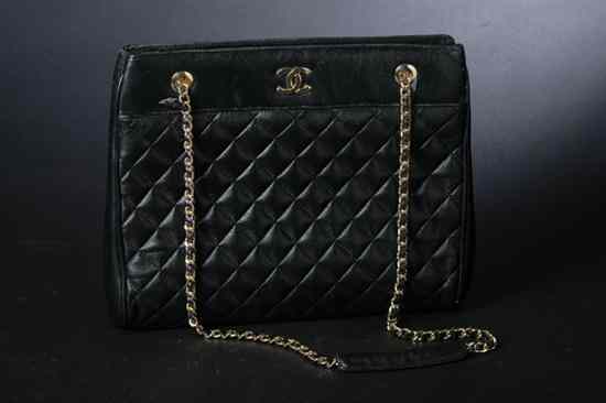 Appraisal: CHANEL BLACK QUILTED LEATHER HANDBAG Divided lipstick red leather interior