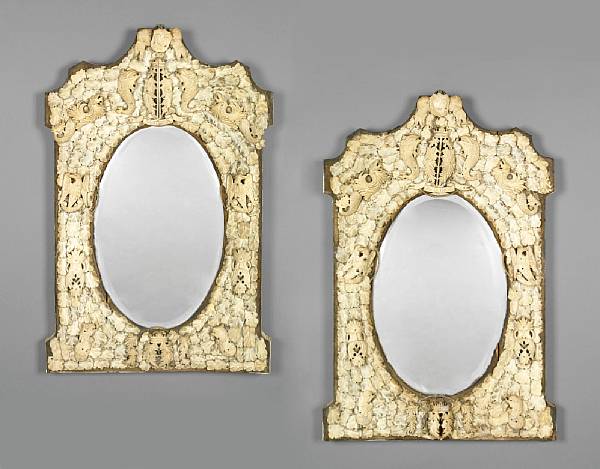 Appraisal: A pair of carved ivory mirrors probably Dieppesecond half th