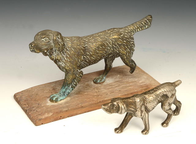 Appraisal: A CAST BRASS SCULPTURE of a dog long together with