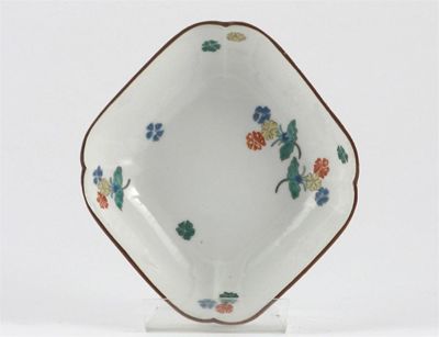 Appraisal: A Japanese quatre-lobed dish moulded with stylized floral garlands and