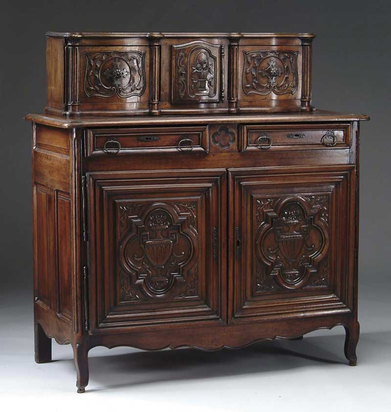 Appraisal: CONTINENTAL TH CENTURY TWO PART CARVED WALNUT CUPBOARD In two