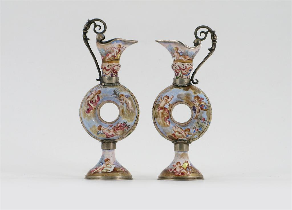 Appraisal: A pair of Vienna miniature enamelled ewers