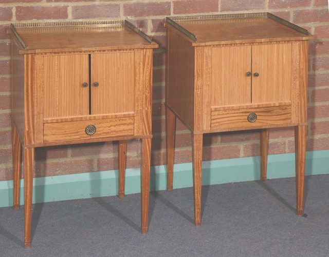 Appraisal: A PAIR OF CONTINENTAL SATINWOOD BEDSIDE CABINETS each with brass