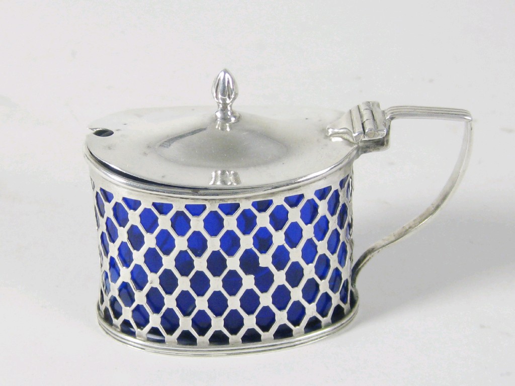 Appraisal: A Victorian pierced oval Mustard Pot with blue glass liner