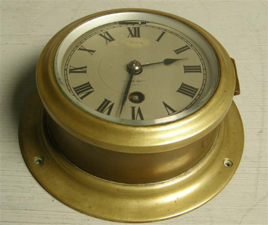 Appraisal: Brass cased ship's bulkhead clock th century by Watt dial