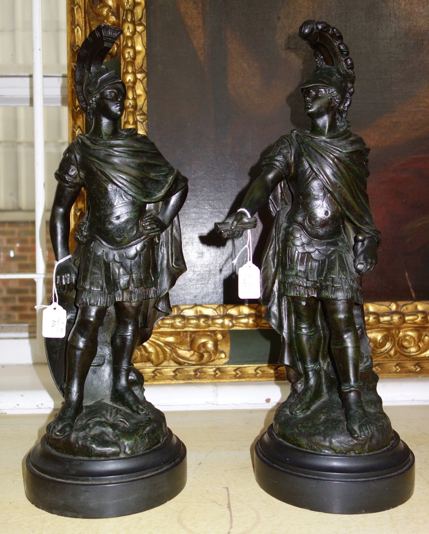 Appraisal: A pair of composite bronze figures th century each depicting