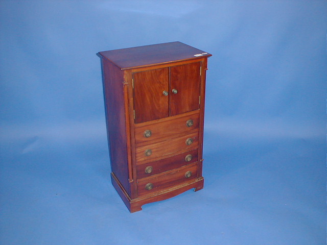 Appraisal: A mahogany bedside chest and pot cupboard in the Georgian