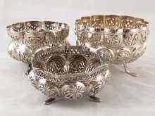 Appraisal: Three embossed and pierced white metal footed bowls test silver