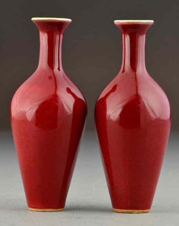 Appraisal: Pr Chinese Monochrome Porcelain VasesPainted strawberry red with two concentric