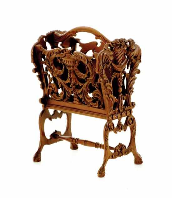 Appraisal: Chippendale style walnut magazine rack carved and shaped handle above